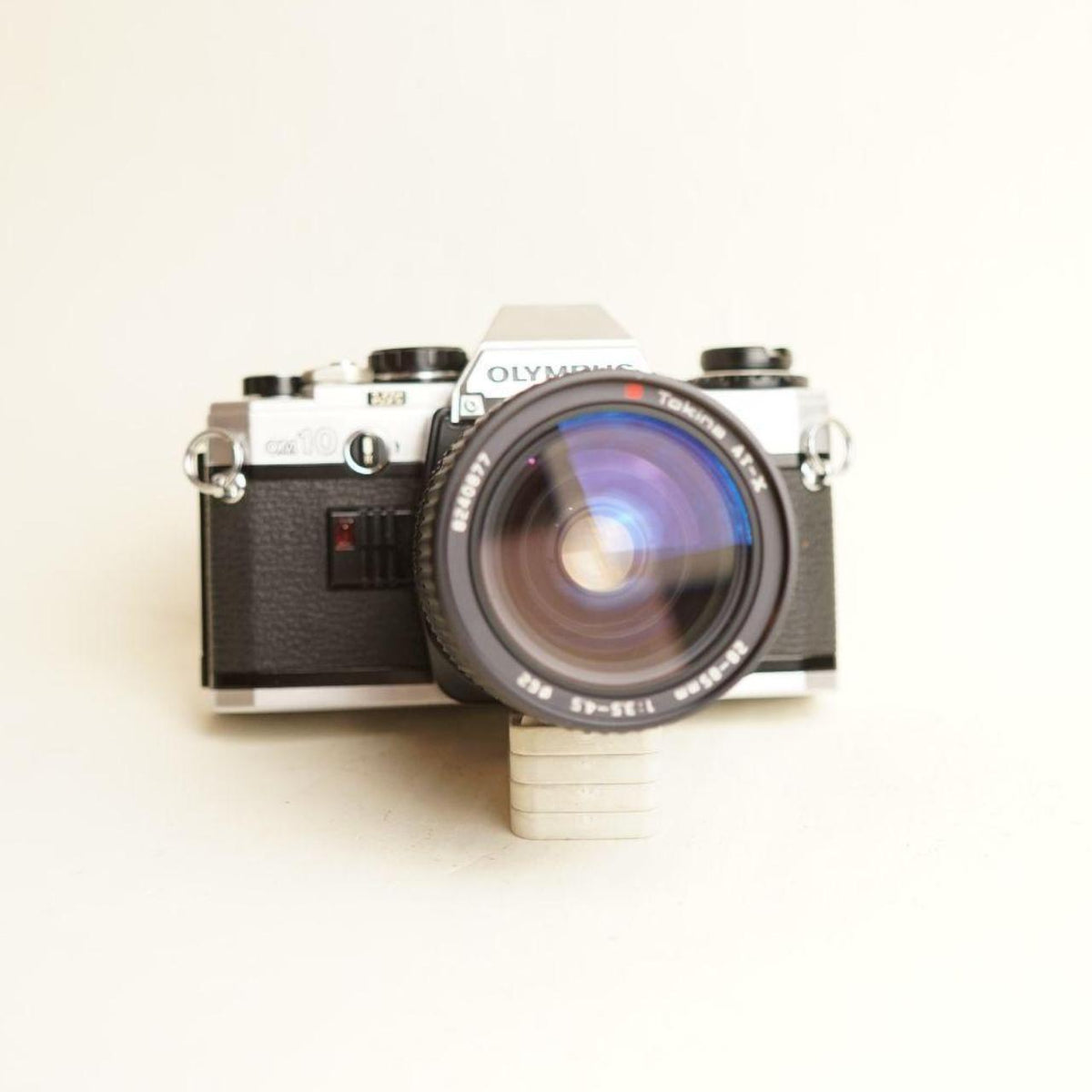 Olympus OM10 35mm Film Camera | Tokina AT-X 28-85mm f/3.5-4.5 Lens | B Condition
